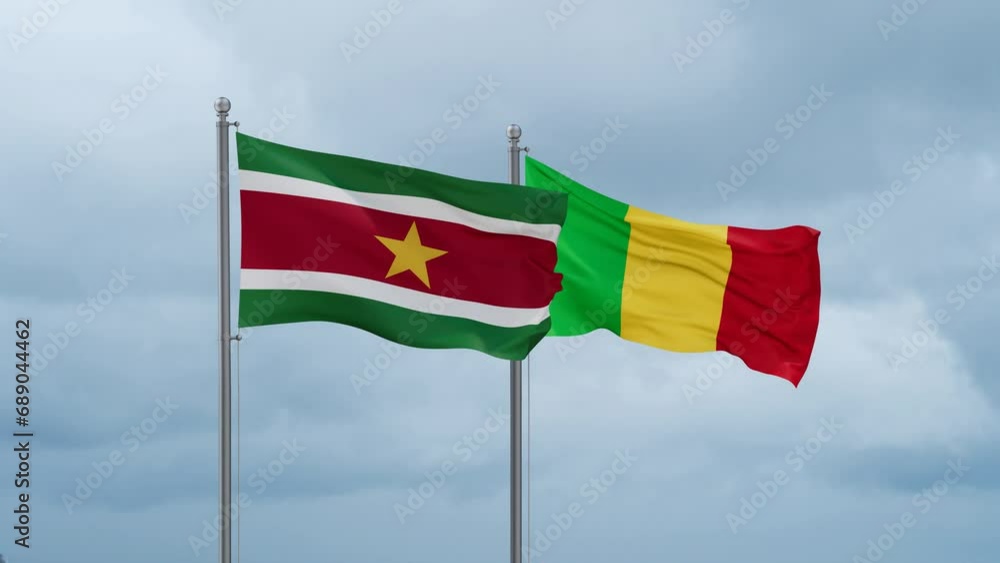 Mali and Suriname flags waving together on cloudy sky, endless seamless loop, two country relations concept Mali and Suriname flags waving together on cloudy sky, endless seamless loop, two country relations concept