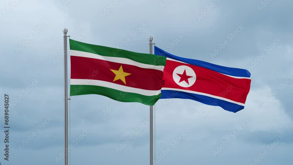 North Korea and Suriname flag waving together on cloudy sky, endless seamless loop North Korea and Suriname flag waving together on cloudy sky, endless seamless loop