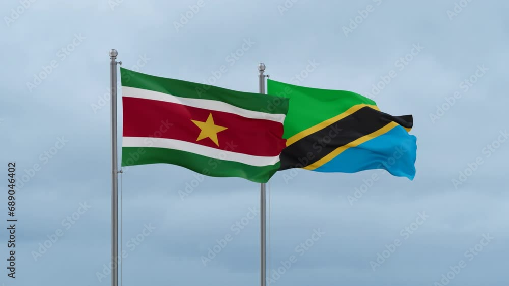 Tanzania and Suriname flag waving together on cloudy sky, endless seamless loop, two country cooperation concept Tanzania and Suriname flag waving together on cloudy sky, endless seamless loop, two country cooperation concept