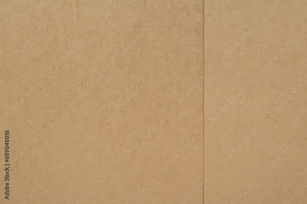 Brown paper made from kraft pulp. Natural texture, background Brown paper made from kraft pulp. Natural texture, background