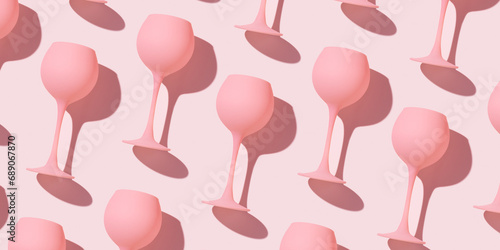 Minimal trend pattern from pink colored wine glasses as pastel pink banner, monochrome geometric stylish layout of goblets. Entertainment, event, party concept. Abstract alcohol drinks