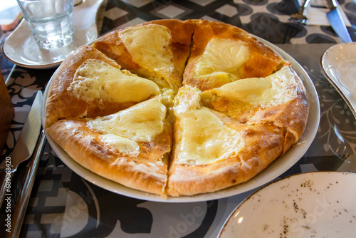 travel to Georgia - Georgian traditional Lazian khachapuri in local cafe in Batumi city photo