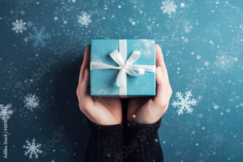 hand hold christmas present with bow