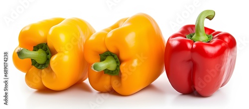 Red and yellow peppers on a white background.