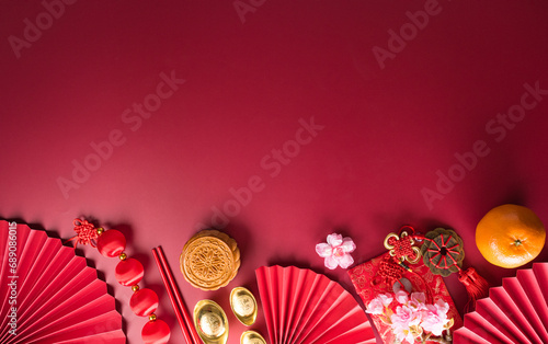 Chinese new year decorations made from red packet, orange and gold ingots or golden lump. Chinese characters on the object means to fortune, good luck, wealth, and money flow.