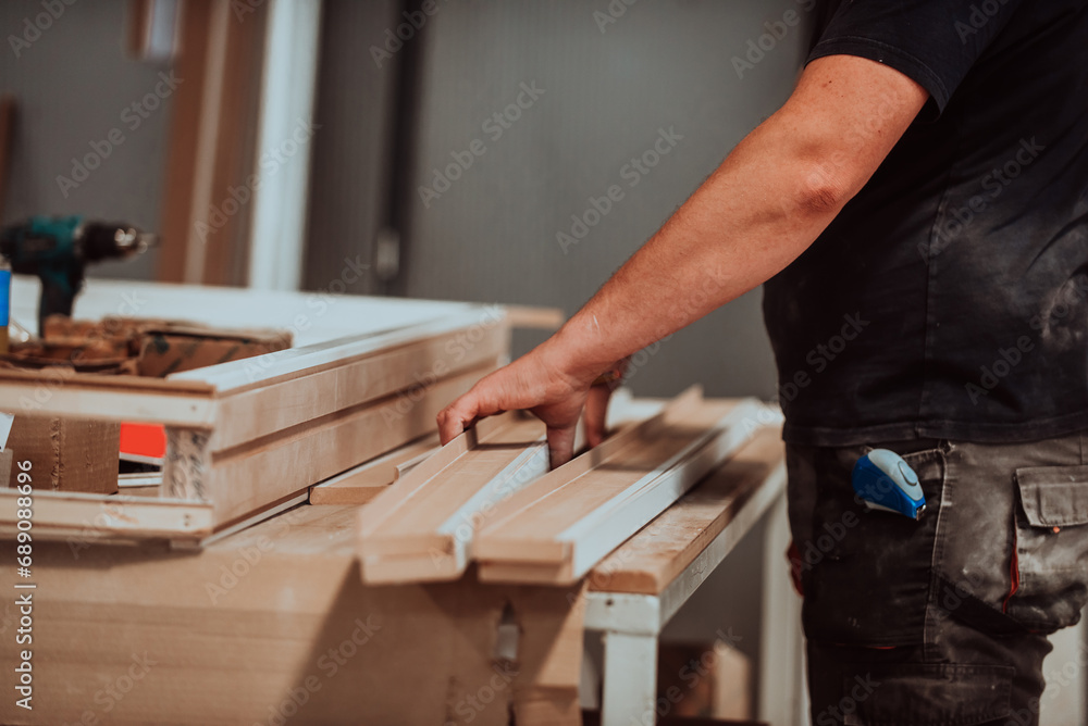 A skilled worker in the woodworking industry adeptly utilizes modern machinery to process and prepare wooden doors for the market, showcasing a seamless blend of traditional craftsmanship and cutting A skilled worker in the woodworking industry adeptly utilizes modern machinery to process and prepare wooden doors for the market, showcasing a seamless blend of traditional craftsmanship and cutting