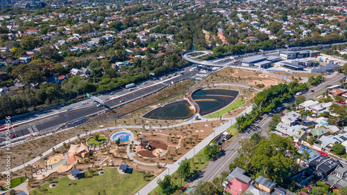 Aerial drone view at Rozelle Interchange in Sydney, NSW Australia, shot on 3 December 2023, showing the walkway overpass and park 