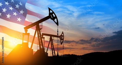 Oil drilling derricks at desert oilfield. The change in oil prices caused by the war. Oil price cap concept.