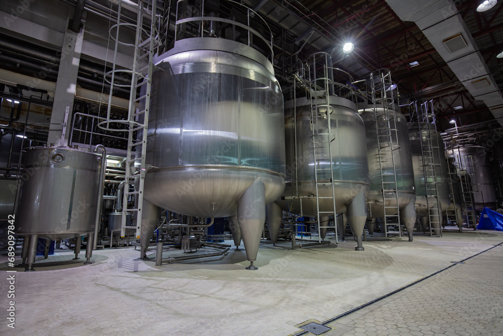 Modern milk cellar with stainless steel tanks Modern milk cellar with stainless steel tanks