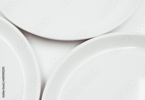 White round plate on white background copy space