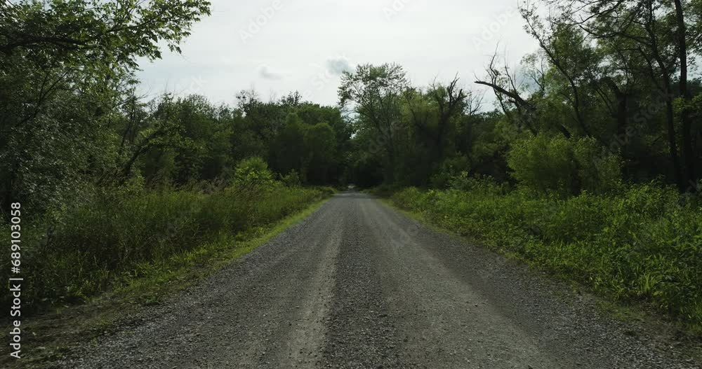Empty Rough Road In A Remote Nature Landscape Near Lamar, Barton County, Missouri, United States. POV Empty Rough Road In A Remote Nature Landscape Near Lamar, Barton County, Missouri, United States. POV
