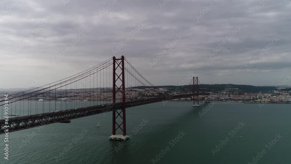 Aerial view of 25th April Bridge in Lisbon, Portugal. Famous landmark on river Tagus. High quality photo Aerial view of 25th April Bridge in Lisbon, Portugal. Famous landmark on river Tagus. High quality photo