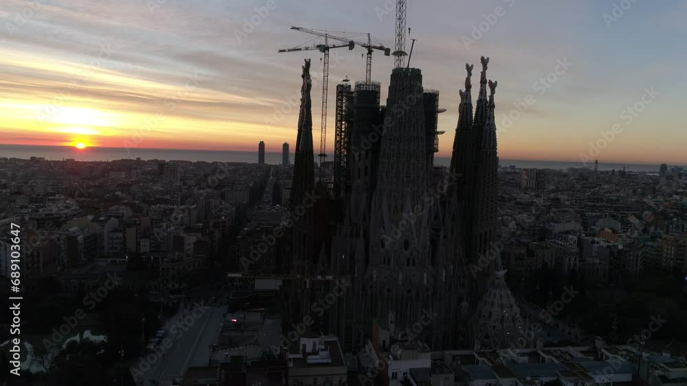 Temple Expiatori La Sagrada Familia in Barcelona, Catalonia, Spain. Flying around the architectural masterpiece of Gaudi in the sunrise, UHD, 4K Temple Expiatori La Sagrada Familia in Barcelona, Catalonia, Spain. Flying around the architectural masterpiece of Gaudi in the sunrise, UHD, 4K