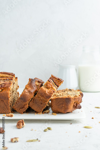 Banana bread on a light background. Homemade cakes with banana and nuts.