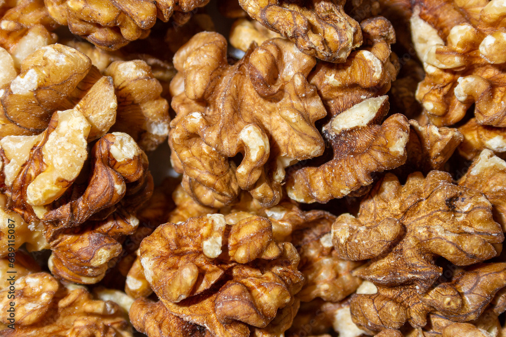 Scattered Shelled Walnuts. Background from Walnut. Natural High-Calorie Snacks Scattered Shelled Walnuts. Background from Walnut. Natural High-Calorie Snacks