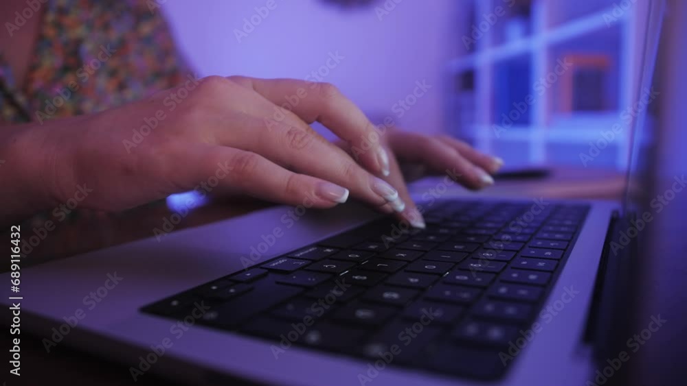 Closeup of hands of business person typing on laptop keyboard at the desk in home office. Closeup of female hands working on laptop keyboard. Businesswoman using laptop. Closeup of hands of business person typing on laptop keyboard at the desk in home office. Closeup of female hands working on laptop keyboard. Businesswoman using laptop.