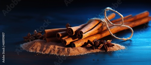 cinnamon sticks and anise on a blue background.