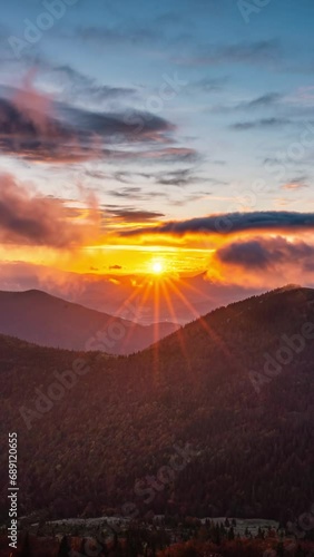 Magic light of sunrise in autumn mountains nature Vertical Time lapse