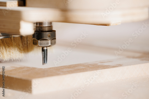 Close-up cutting wood on CNC milling machine for kitchen furniture wooden on factory