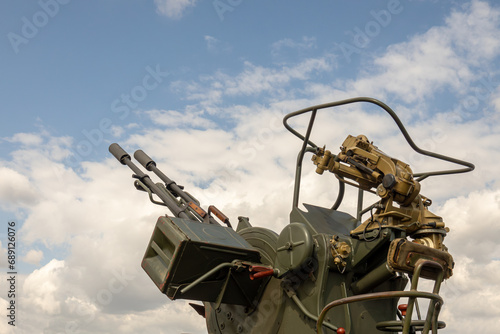 Anti aircraft artillery, double-barreled machine gun. Anti-aircraft artillery vehicle. photo