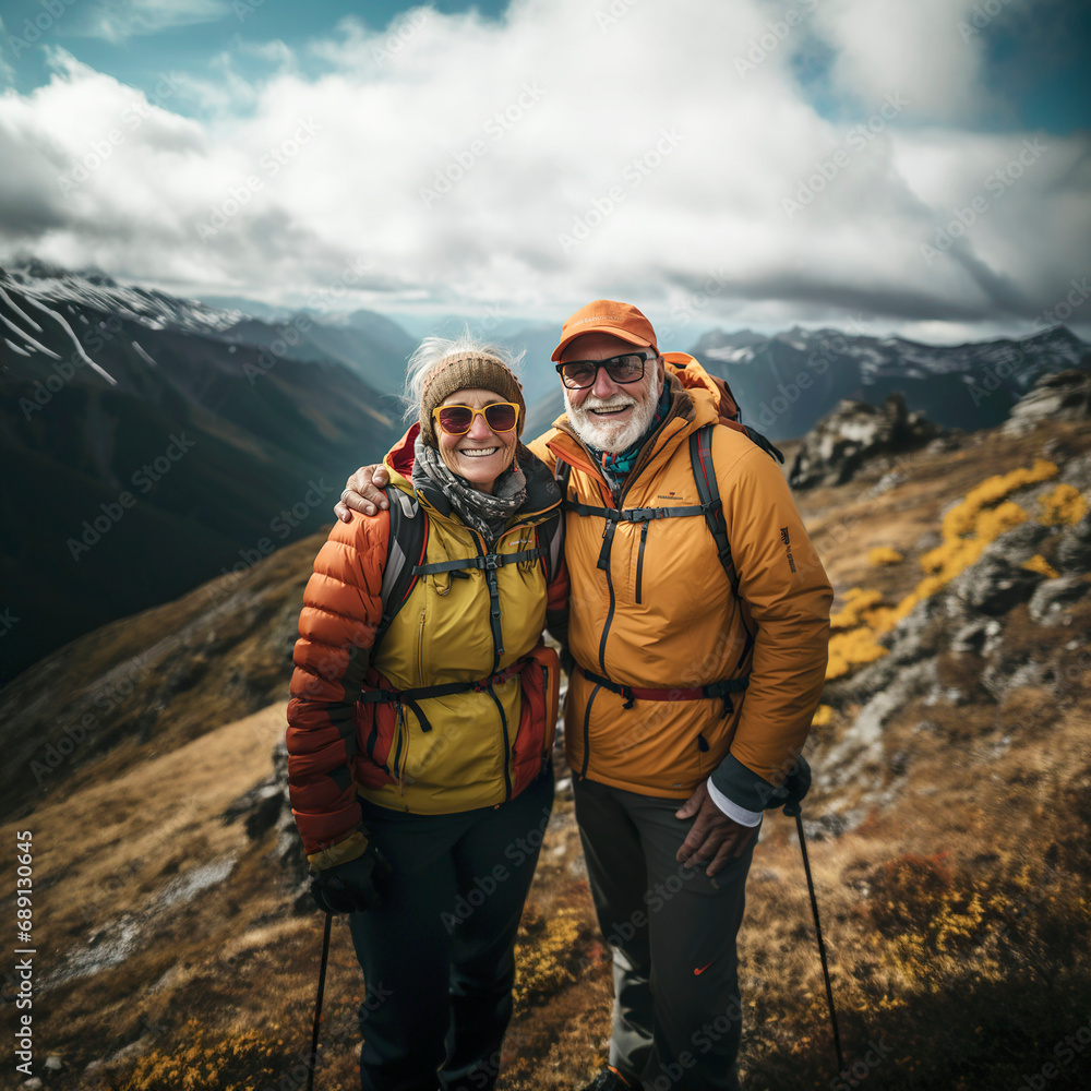 A well-equipped middle-aged couple in the high mountains