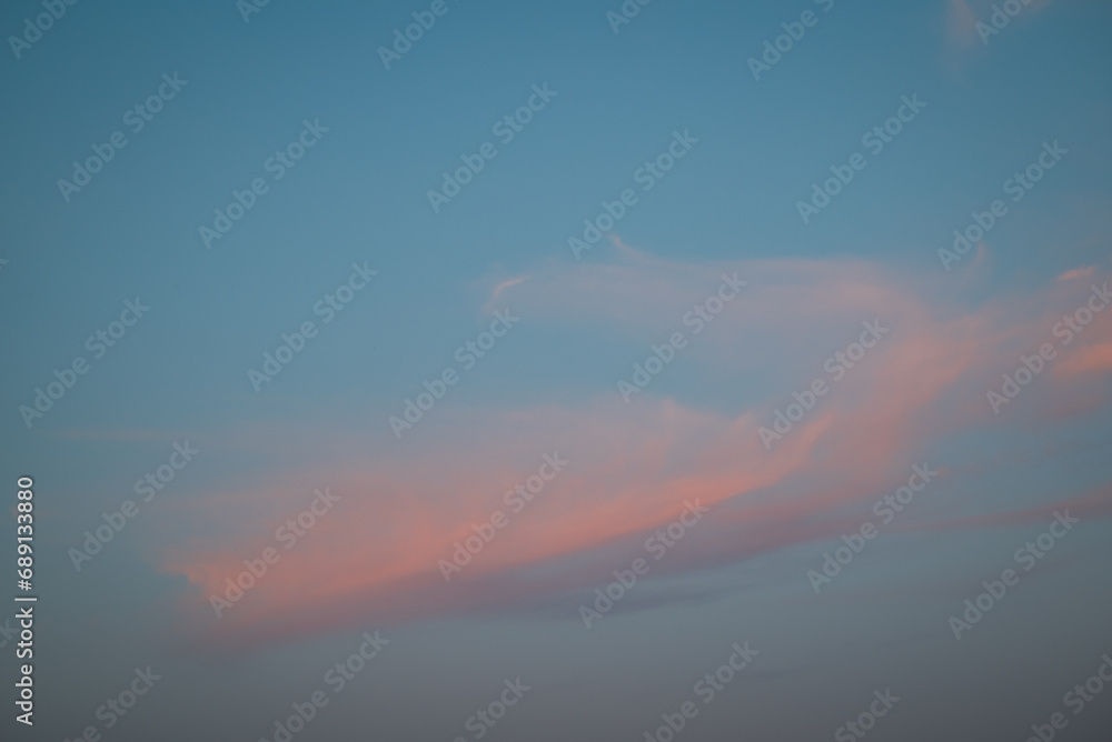 Light clouds in sky during sunset. Colourful clouds in the sky, evening photo