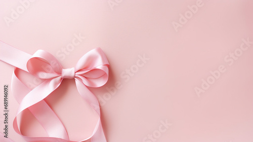 pale pink background with pink ribbon with place for text © kazakova0684