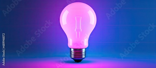 Blue LED smart bulb with multicolor backdrop for your design top view trendy neon backlight Copy space image Place for adding text or design