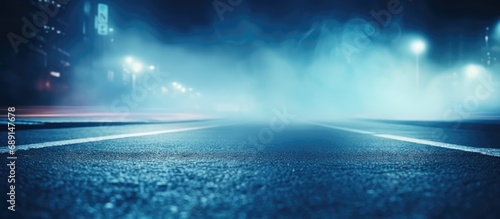 Desolate street with blue smoke dimly lit surroundings Copy space image Place for adding text or design photo
