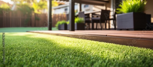 Modern Australian home with wooden edged artificial grass in the front yard Copy space image Place for adding text or design photo
