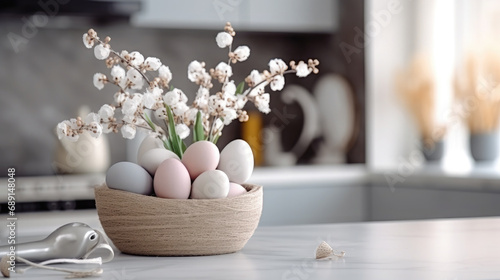 basket with multi-colored Easter eggs on the table in a stylish kitchen, minimalism, Scandinavian interior, postcard, spring, design, religious holiday, traditional dish, treat, decor, flowers photo