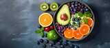 Dietary food bowl with sweet potatoes blueberries avocado cabbage and orange Top view with free space for text Copy space image Place for adding text or design