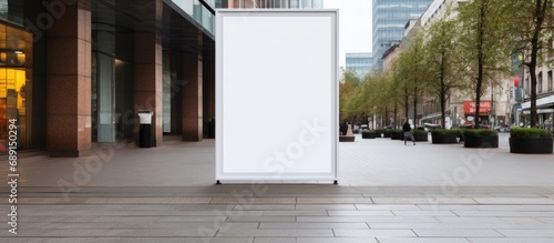 Mock up of a clear street signage board in an urban city environment placed outdoors on a pedestrian sidewalk Copy space image Place for adding text or design photo