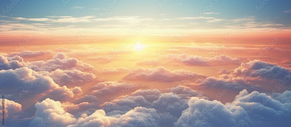 Aircraft viewpoint above clouds displaying breathtaking sunset Copy space image Place for adding text or design