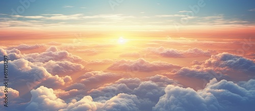 Aircraft viewpoint above clouds displaying breathtaking sunset Copy space image Place for adding text or design photo