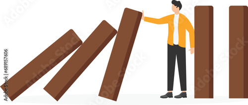 Businessmen stopping falling dominoes. Symbol of crisis, risk, management, leadership concept.

