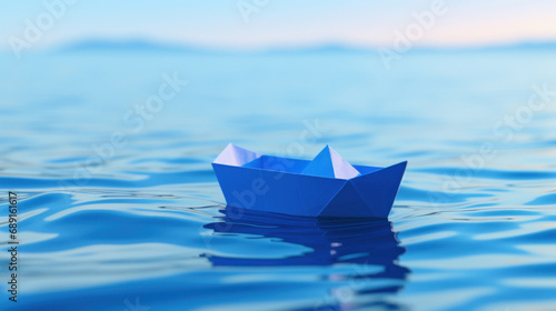 Paper boat floating in the sea.