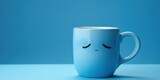  Sad blue mug with sad emoji, on a blue background, blue monday, copy space, banner