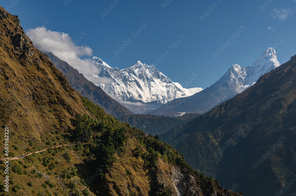 View of Nuptse, Everest and Lhotse mountains during trekking in Nepal in a clear day. EBC or Three passes trek in Nepal. Mountain range Himalayas in the Khumbu region of Nepal, Asia.