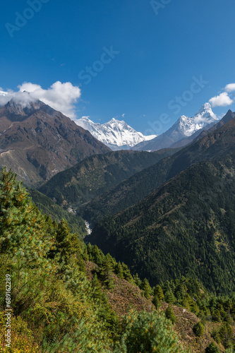 View of Nuptse, Everest and Lhotse mountains during trekking in Nepal in a clear day. EBC or Three passes trek in Nepal. Mountain range Himalayas in the Khumbu region of Nepal, Asia. © Lizaveta