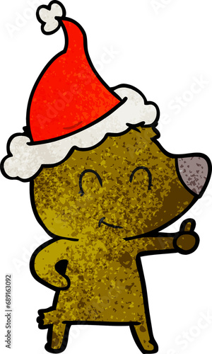 female bear hand drawn textured cartoon of a wearing santa hat © lineartestpilot