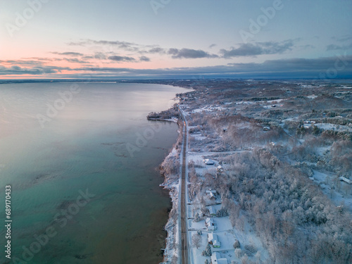 Winter's Serene Embrace: A Breathtaking Aerial View of Snow Covered Suttons Bay in Northern Michigan