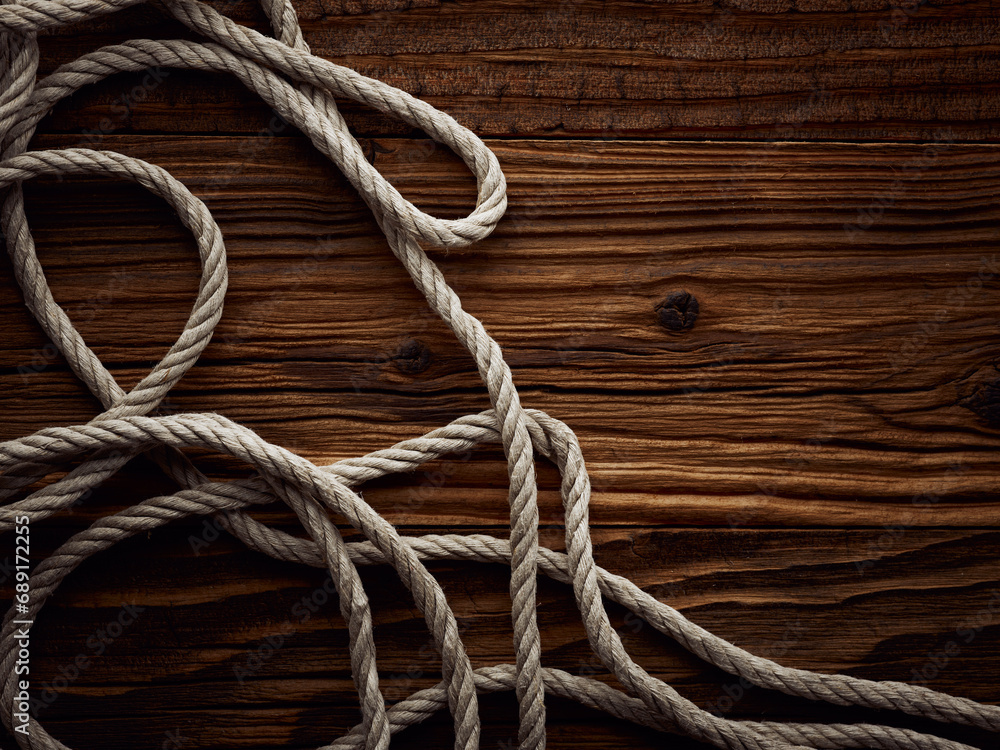 Obraz premium Dark vintage marine background with old hemp rope