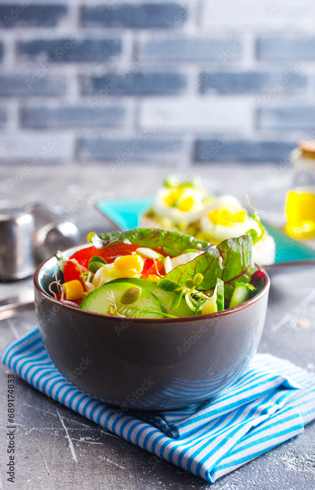 Green vegan salad from green leaves mix and vegetables. diet food Green vegan salad from green leaves mix and vegetables. diet food