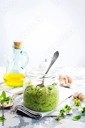 pesto sauce in glass jar, sauce from basil
