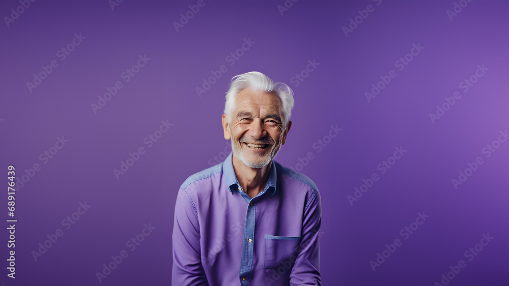 Fototapeta premium Old man smiling isolated on studio background. Copyspace area