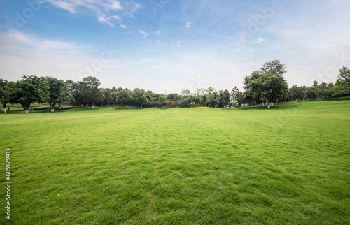 Green lawn in urban public park photo