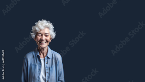Beautiful old woman smiling isolated on studio background. Copyspace area © Mangata Imagine