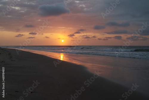 Sunset on the beach in Tumbes, Peru with waves and sand. © JF:Carpio