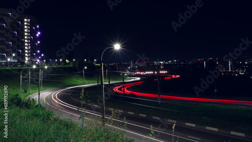 Lights of cars driving at night city. Long exposure.